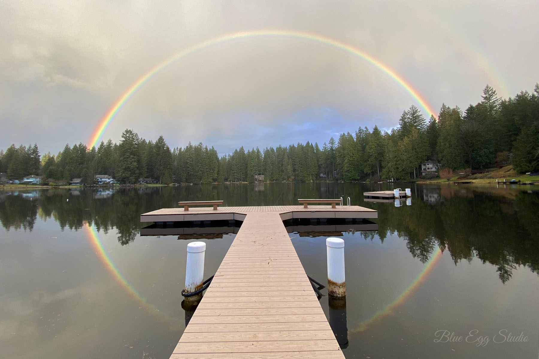 Rainbow reflection at Beach 1 dock, captured by a Lake Marcel resident